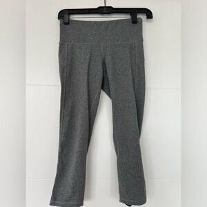 Grey carpi leggings with black ties on back